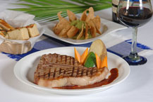 grilled t-bone steak at baja cantina restaurant and dockside bar in cabo san lucas, mexico