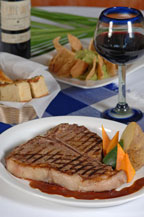 grilled t-bone steak at baja cantina restaurant and dockside bar in cabo san lucas, mexico
