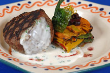 beef fillet in a cheese sauce served at hacienda del cuervo restaurant - cabo san lucas
