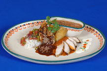 chicken with red and black mole sauce served at hacienda del cuervo restaurant - cabo san lucas