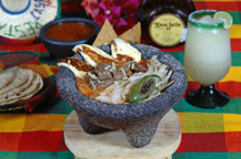 beef molcajete - stone dish - served at la casa country restaurant in cabo san lucas