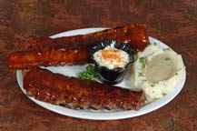 bbq baby back ribs served at the original park restaurant - cabo san lucas, mexico